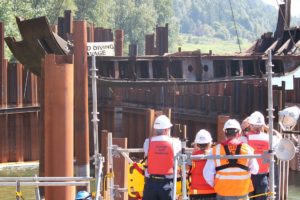 Spectators from "Unified Command" watch as the final 60-foot, 50,000 pound piece of steel from the derelict Davy Crockett vessel is lifted in August from the Columbia River. The deconstruction project, which began in January, was officially completed earlier this month with the removal of an 850-linear foot cofferdam and impermeable liner used in the cleanup effort.