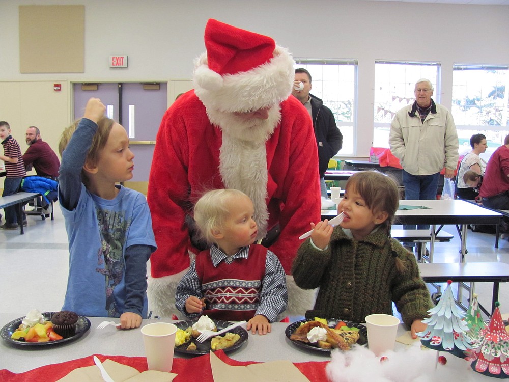 Santa Claus made the rounds Saturday morning, during a special event at Hathaway Elementary School. Children and parents feasted on scrambled eggs, sausages, bacon, muffins, scones and fruit. There were opportunities to win raffle prizes at the event, organized by the Washougal Festival of Trees Committee. Members of the GFWC Camas-Washougal Women's Club assisted, along with students from Washougal High School.