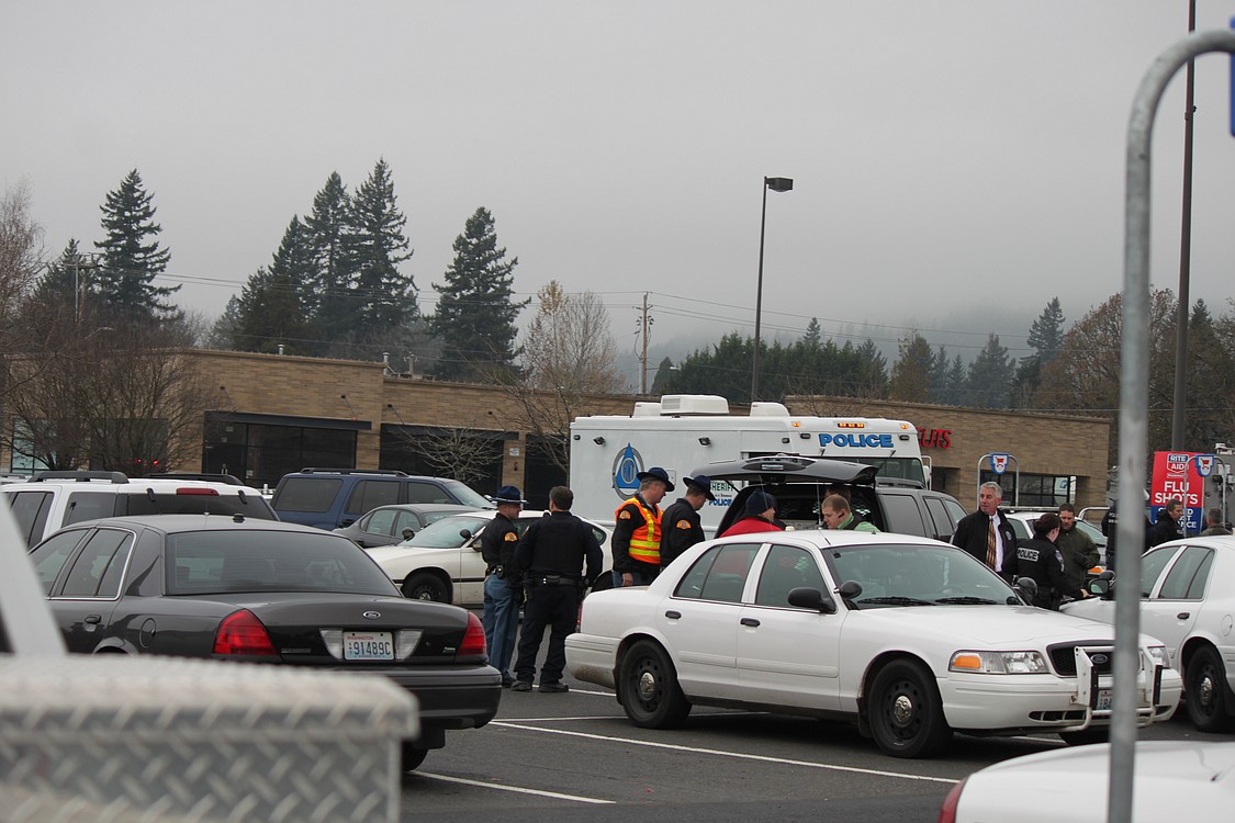 Police established a command post at Riverview Community Bank in Washougal as they created a plan to deal with the shooting suspect and house fire.