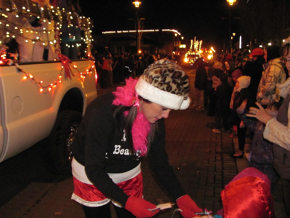 Stylists from Beauty Temptations distributed free emery boards to the crowd watching the parade. Other participants tossed candy from their floats. Bystanders were outfitted with coats and mittens, as they sipped on coffee and hot chocolate.