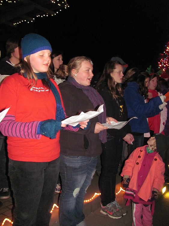 Combined choirs from Washougal High School sang carols during the community Christmas tree lighting ceremony in Reflection Plaza. Live music was also provided by pianist Barbara Curry. Local children assisted Santa with the tree lighting.