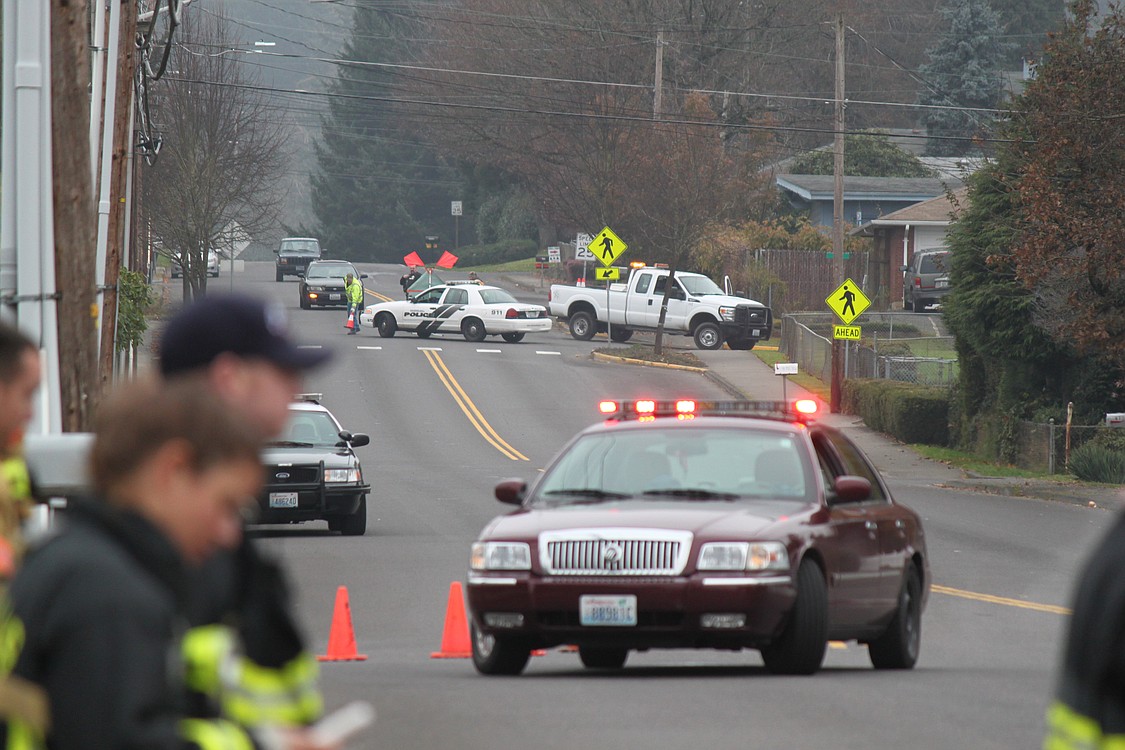 Police blocked off a four-block area in Washougal Wednesday as they responded to reports of shots fired and a house on fire at 3275 &quot;F&quot; Place.