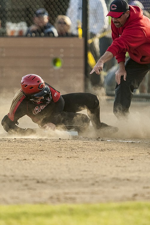 Lena Richards dives into third base after knocking in Amee Aarhus to tie the championship game up at 1-1.