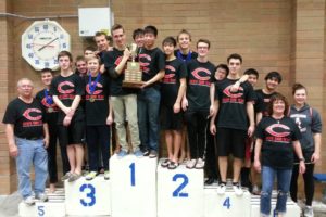 The Camas High School boys swimming team captured the 4A district championship trophy Saturday, in Kelso. The Papermakers won the meet by 100 points.