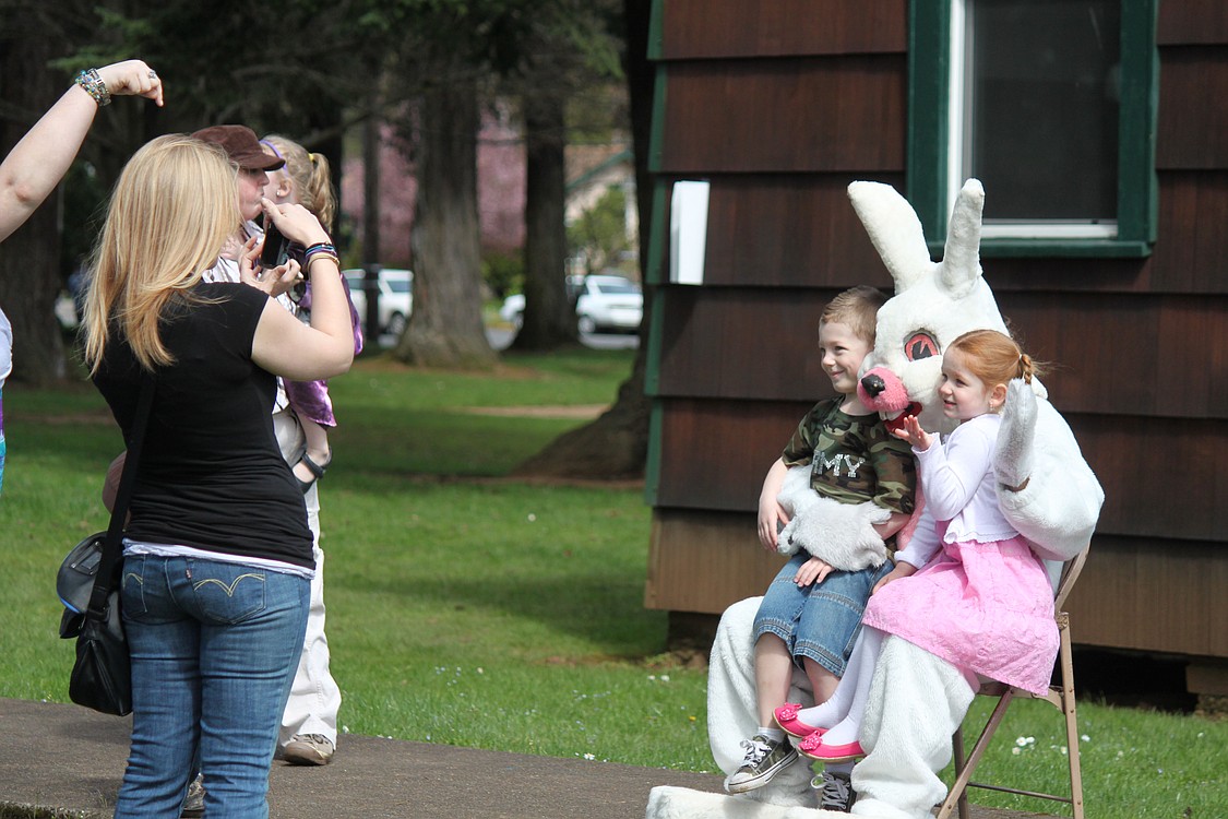 Children waited in line for a chance to pose for pictures with the Easter Bunny during the annual Camas Easter egg hunt on Sunday.