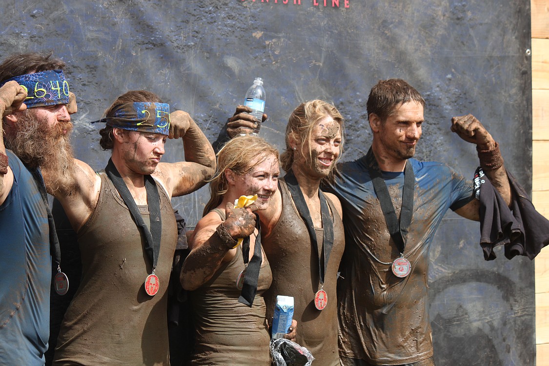 Covered in dirt and mud, bumps and bruises, Spartan Race finishers had many things in common, including broad smiles and feelings of pride and accomplishment.