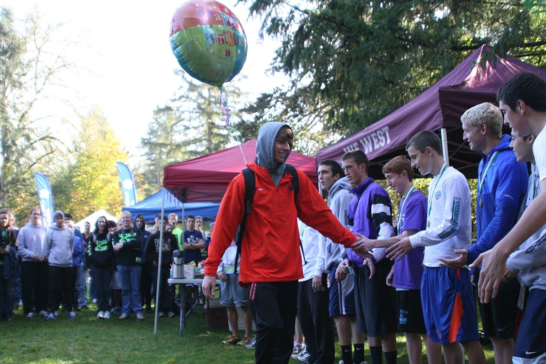 Sean Eustis gets a series of high-fives on his way up to get a first-place medal. Not a bad way to celebrate a 17th birthday.