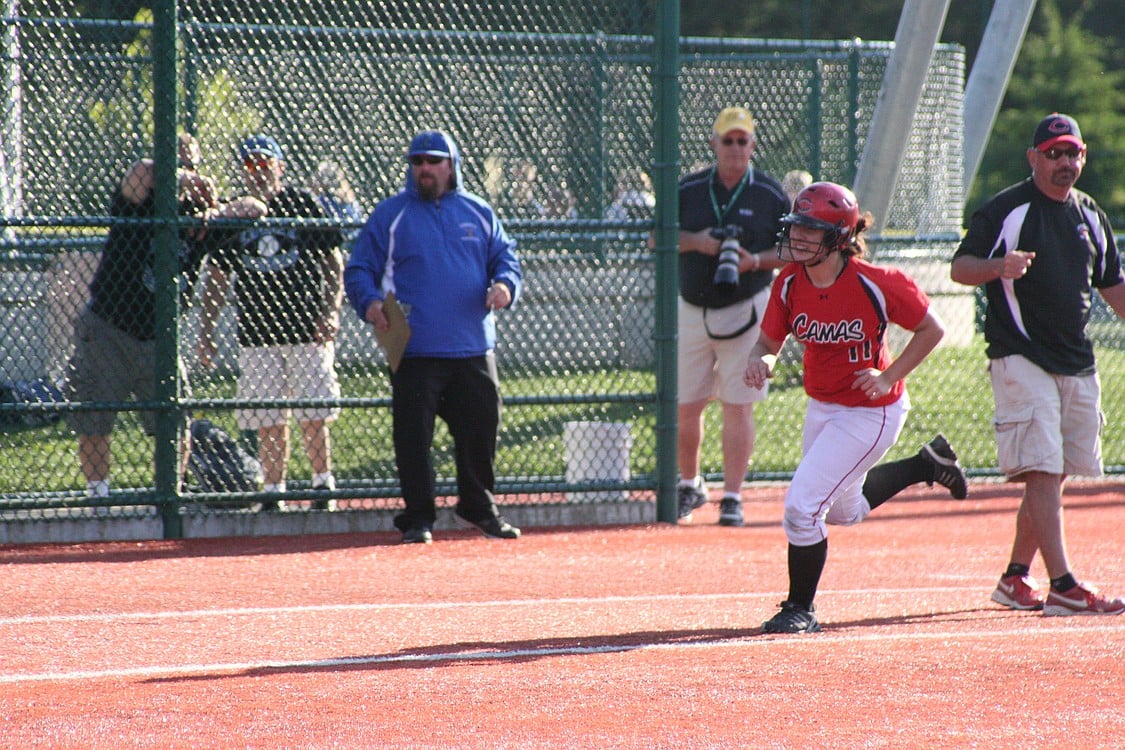 Mikaela Searight rounds third after hitting a game-tying 2-run home run.