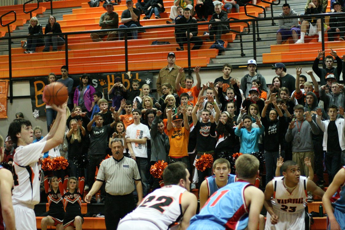 The Panther Pit Crew feels the intensity on their finger tips as Aaron Deister shoots a foul shot. The Washougal boys basketball team defeated Mark Morris for the first time in 41 games, 66-58.