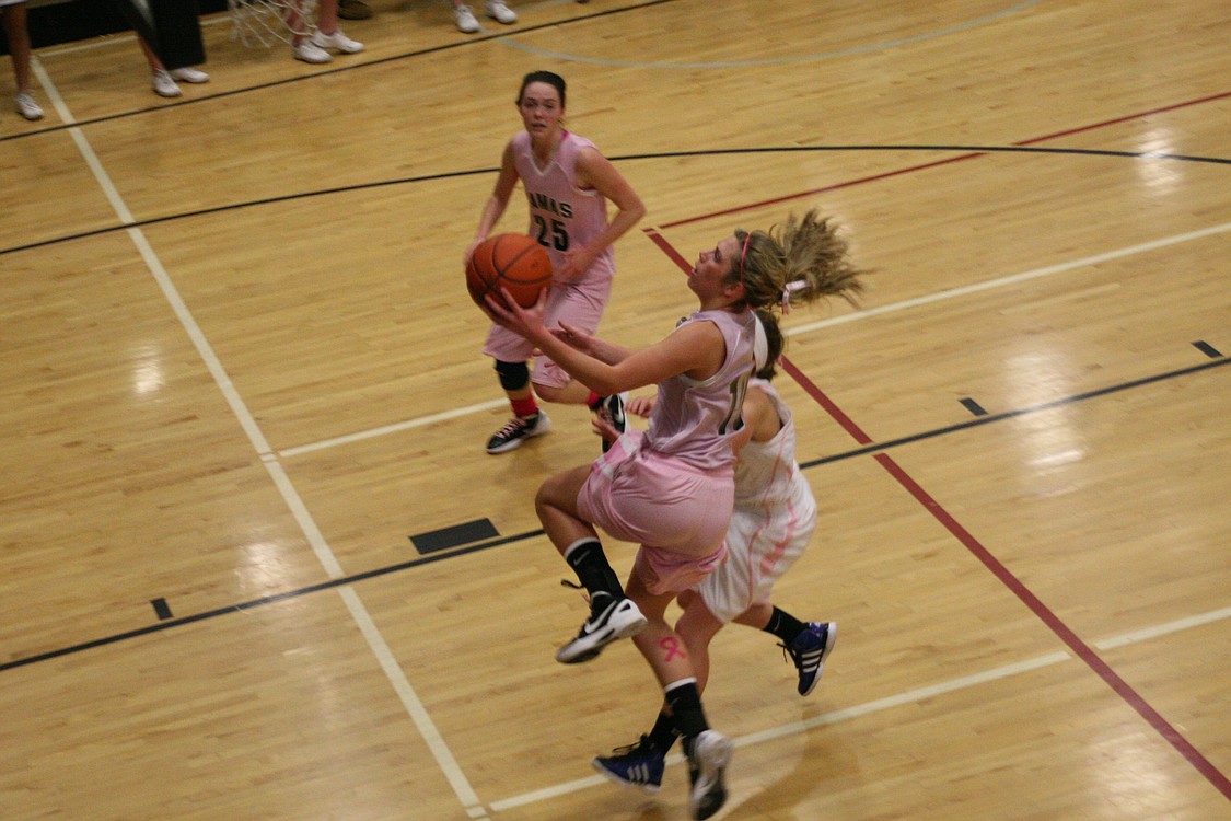 Syndey Allen soars to the hoop.