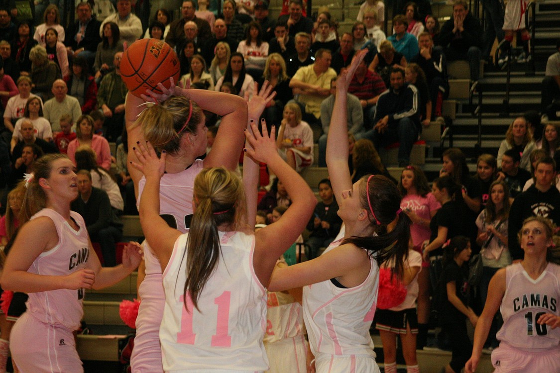 The Mountain View defenders cannot stop Jenka Stiasna from scoring eight points in a row for Camas at the start of the third quarter.