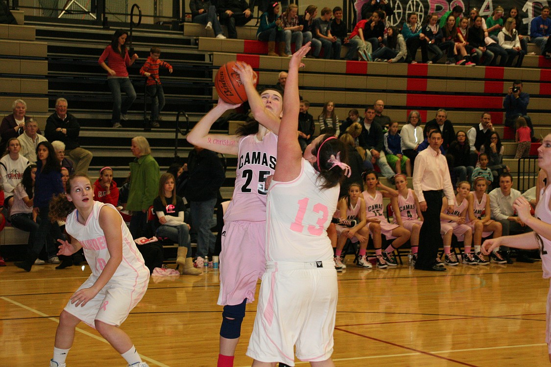 Look closely at Tatum Schroeder's left arm, and you will see the name &quot;Christina&quot; written in pink ink. All of the Camas players did this to honor Christina Bonazelli, the mother of junior varsity player Rachael Bonazelli, who has been stricken with breast cancer.