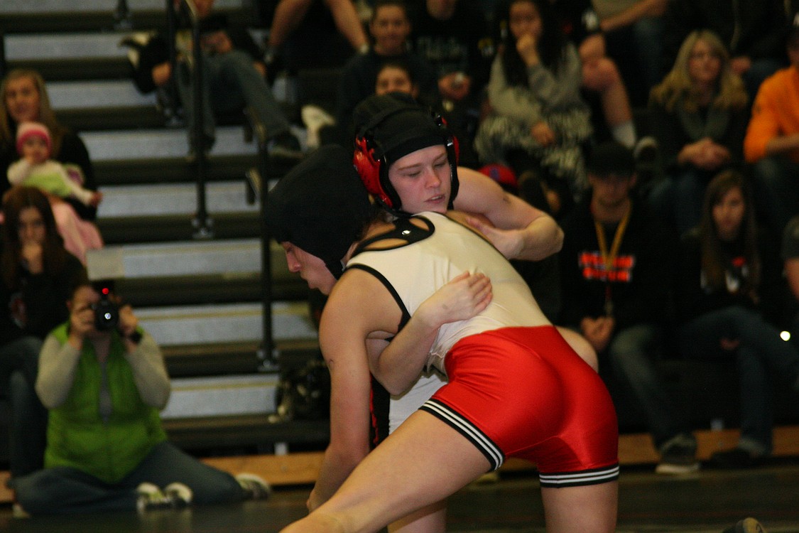 Taryn Lommasson, Camas, tangles with Kassi Strano, Battle Ground. Lommasson earned second place at 106 pounds.