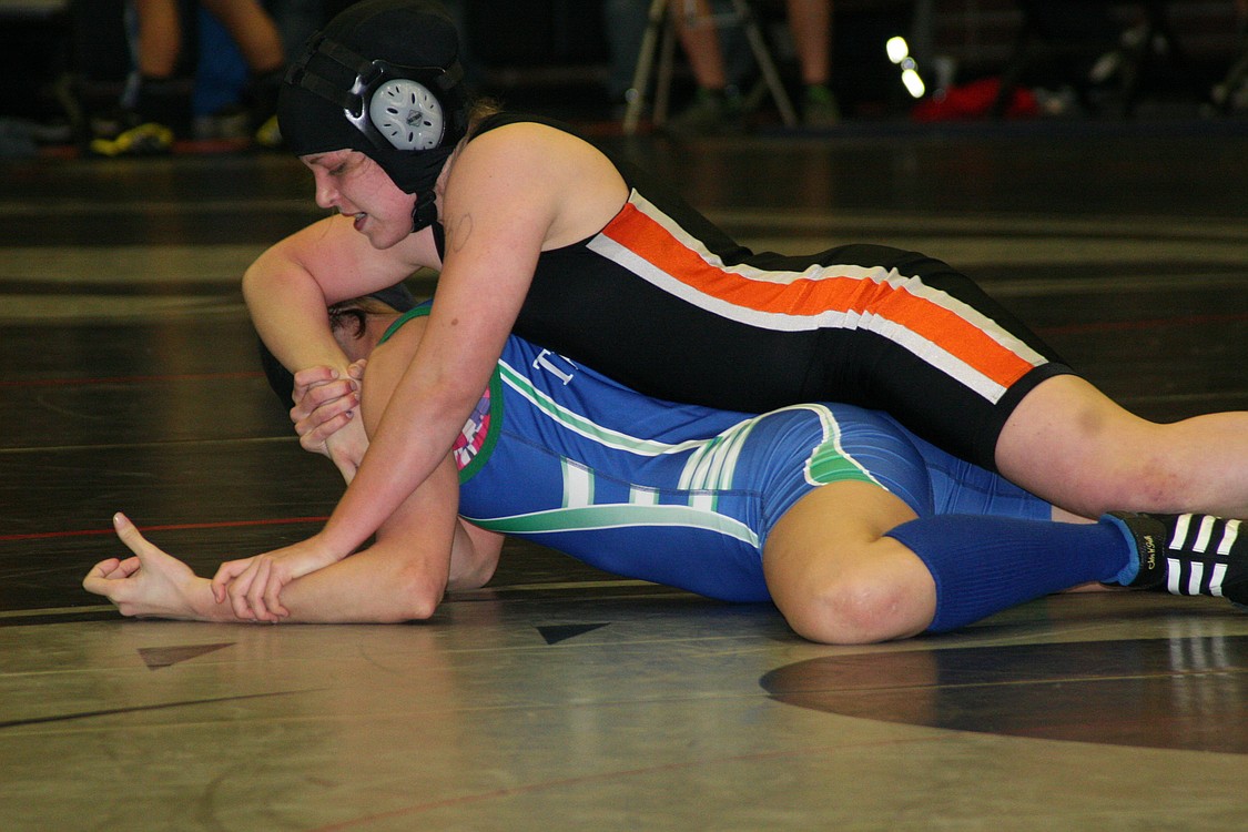 Washougal's Erin Locke ties up Mountain View's Danielle Higgins in the 130-pound championship match. Locke got the opportunity to sing the national anthem before all of the final matches started. She then stepped on the mat and almost became a county champion.