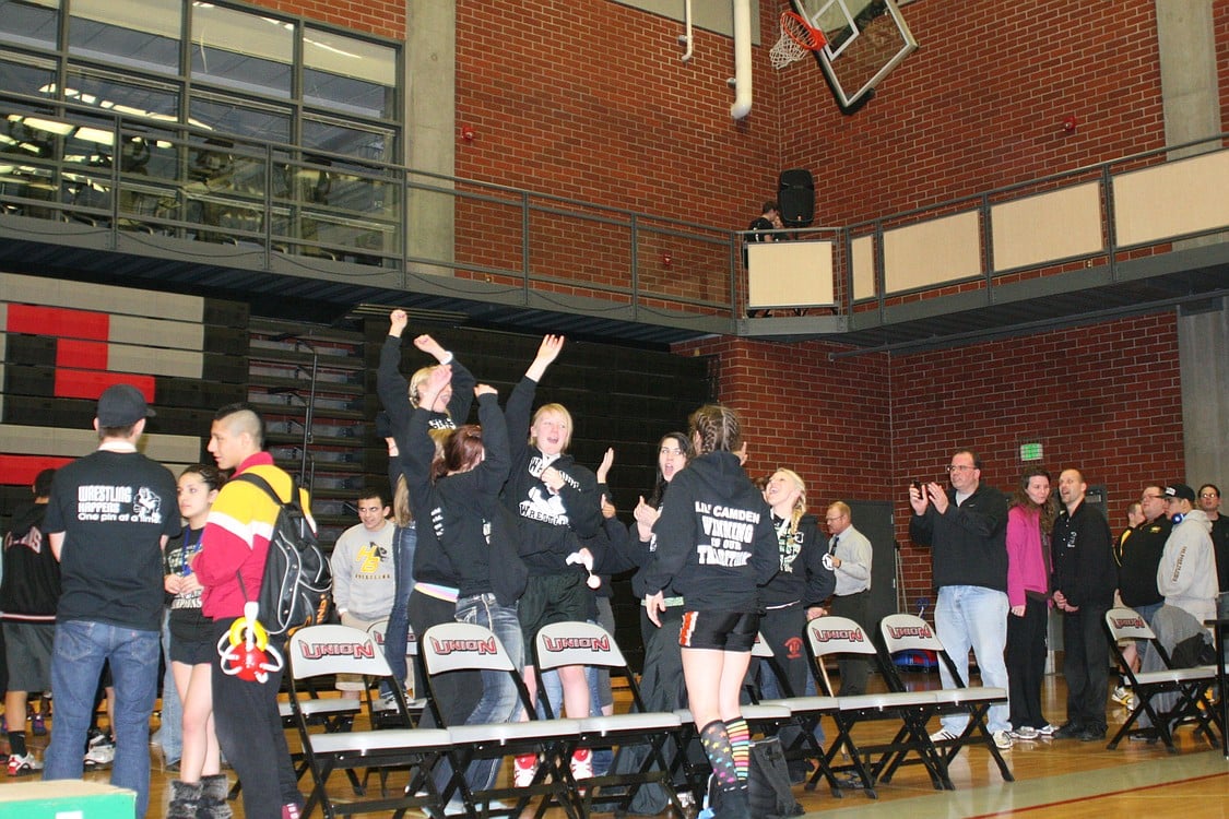 The Washougal girls wrestlers react to being annouced as Clark County Champions.