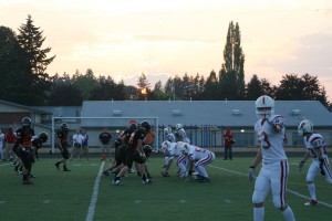 The sun sets on the horizon, as the Washougal and Fort Vancouver high school football teams play at Fishback Stadium Friday night. The Panthers tore the Trappers to shreds 74-7.