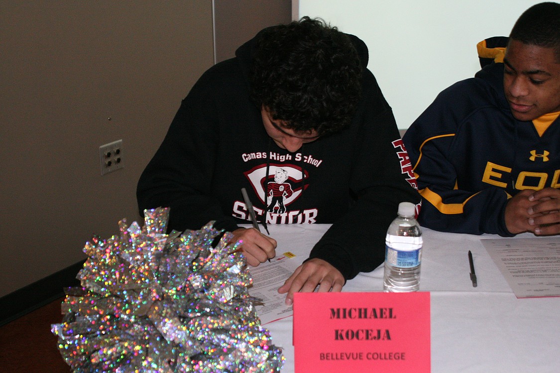Michael Koceja signs with Bellevue College.