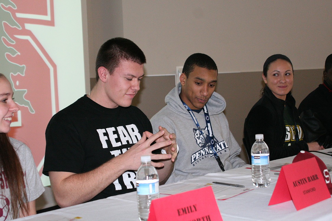 Austin Barr stares back with amazement at his signature to Stanford University.