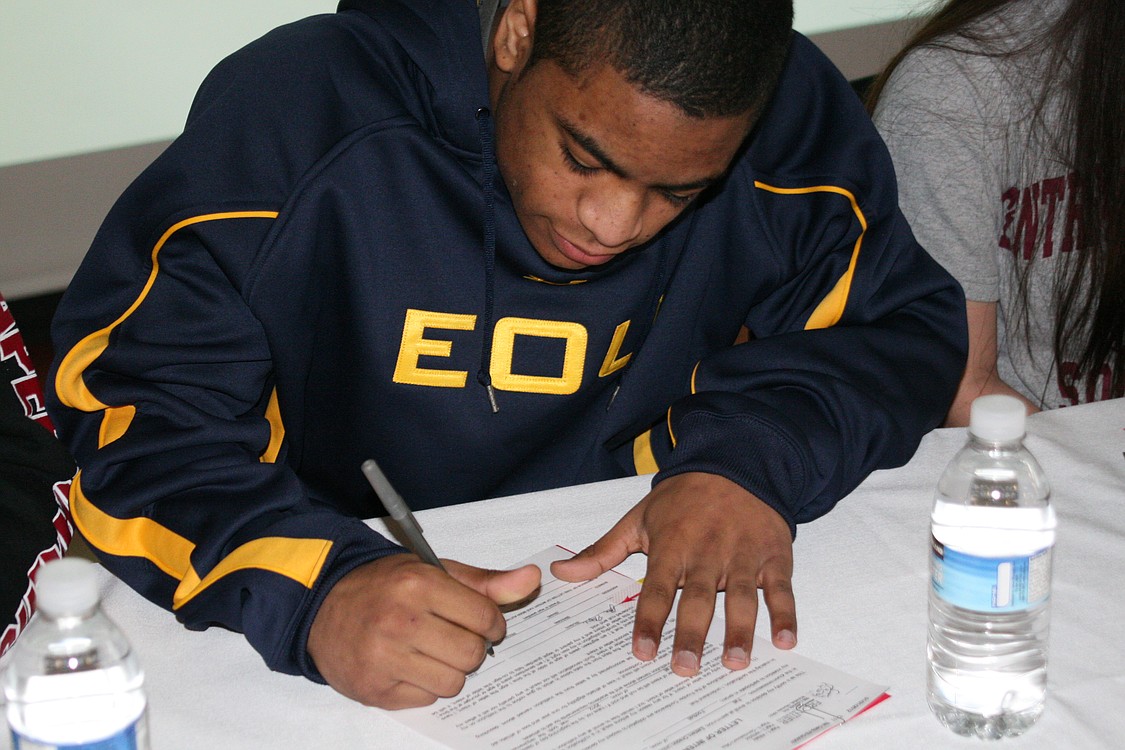 John Payne signs with Eastern Oregon University.