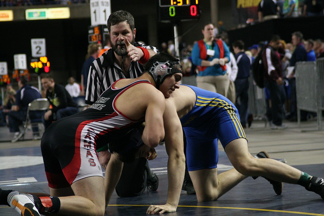 Vince Huber battled back from a loss in the first round by pinning his opponent in this match.