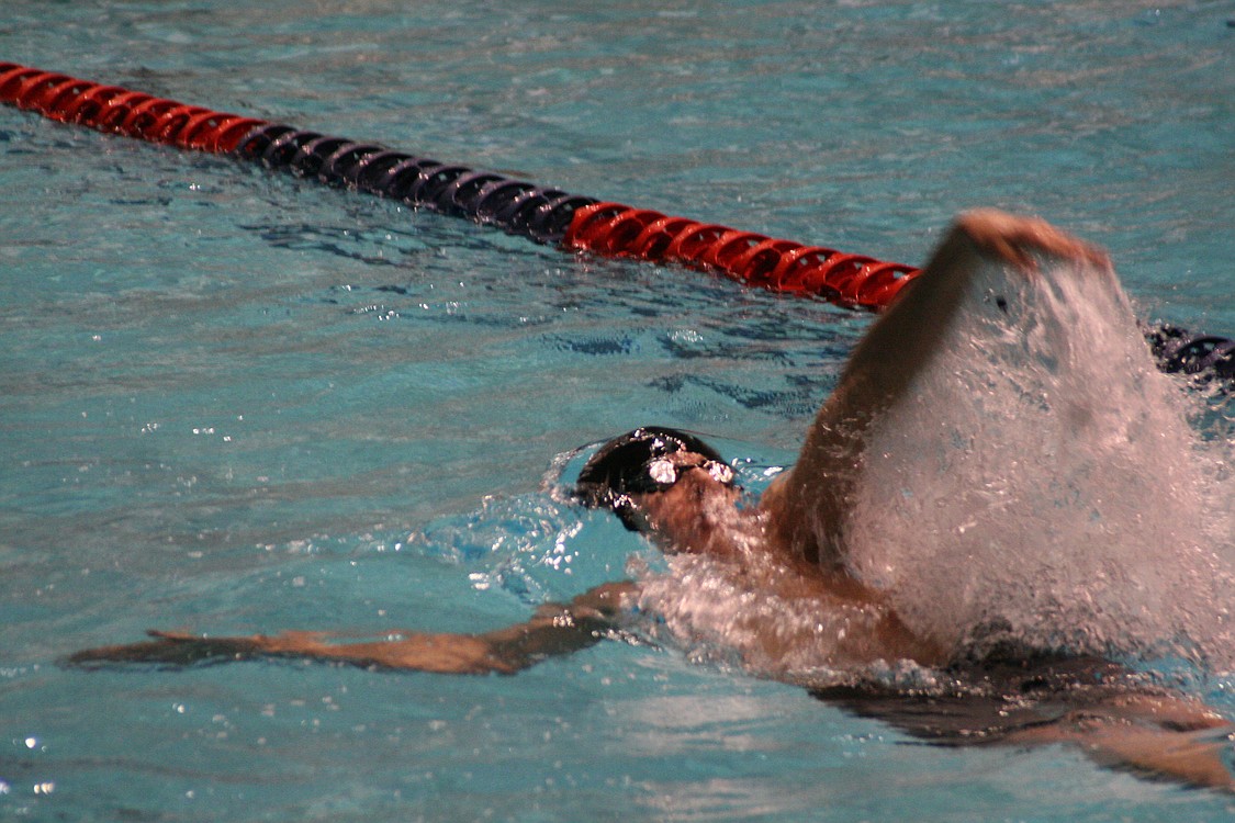 Lucas Ulmer completes the backstroke portion of the 200 medley relay.