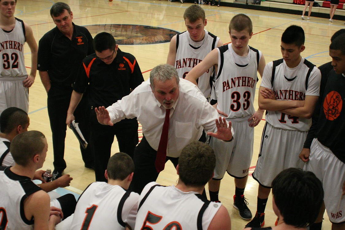 Head coach Malcolm Estes instructs the Panthers during a timeout.