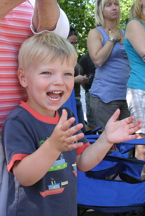 Connor Acheson, 3, of Washougal, was excited to see the bright yellow Silver Star Search and Rescue vehicles make an appearance during the parade. Candy tossed out by many of the parade participants was also a popular feature for the young spectators.