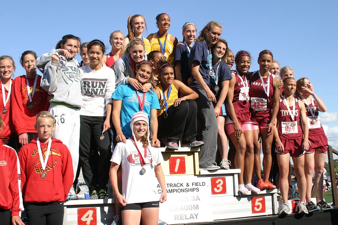 Camas 1,600 relay runners Austen Reiter, Sara Slayton, Ciara Klein and Megan Kelley (top to bottom) stand in second place on the podium at state.