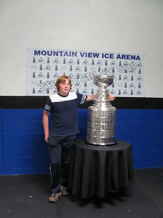 Devon Johnson waited with his mother Erin nearly four hours to be the first one to get his picture by the Stanley Cup.