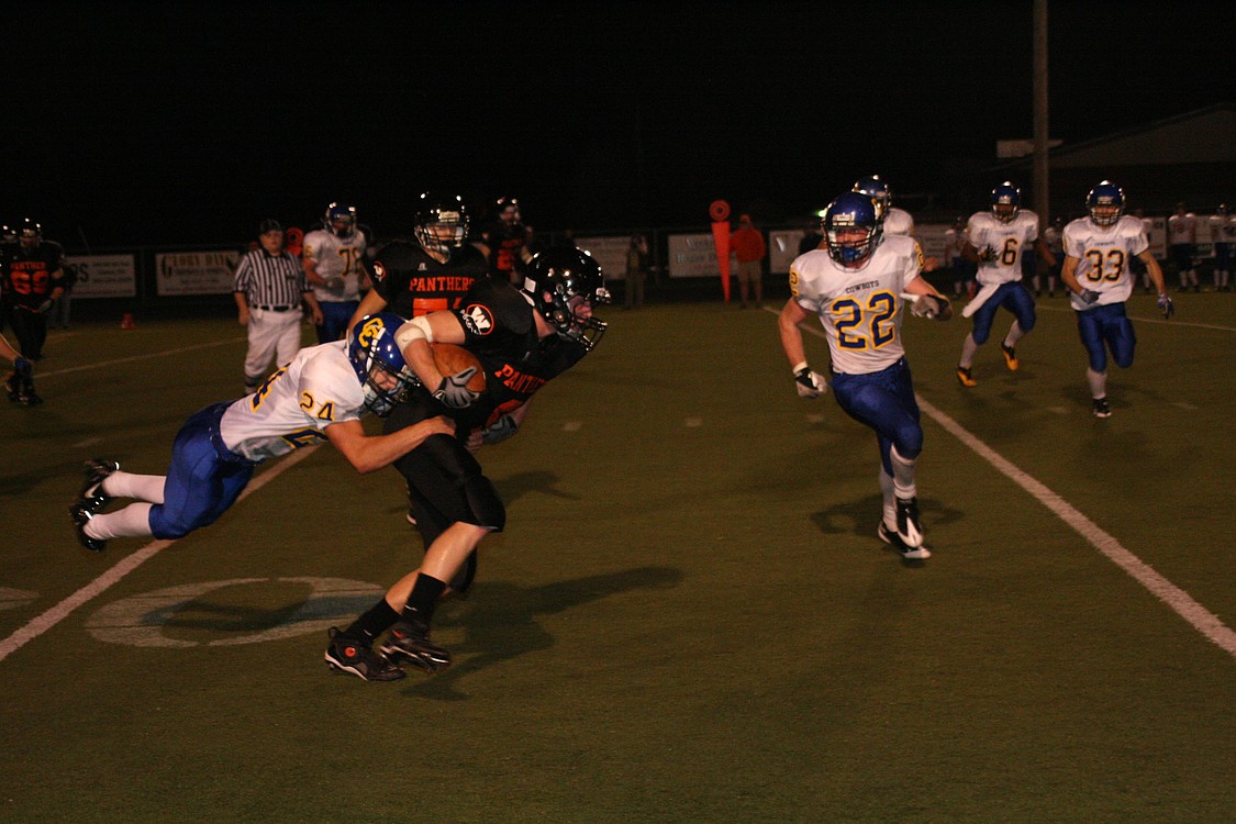 Ryan Erdwins drags a defender with him for more Washougal yards Oct. 10, at Fishback Stadium.