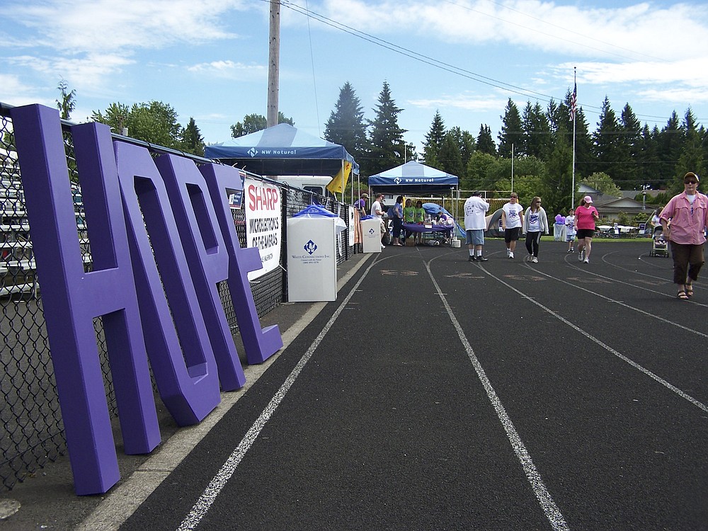 With a vibrant reminder to keep hope in their minds and hearts, participants in last weekends Relay for Life event make their way around the track at Fishback Stadium in Washougal. Hundreds of people took part in the annual 24-hour fundraiser for the American Cancer Society on Saturday and Sunday. The relays theme was Making Cancer Walk the Plank.