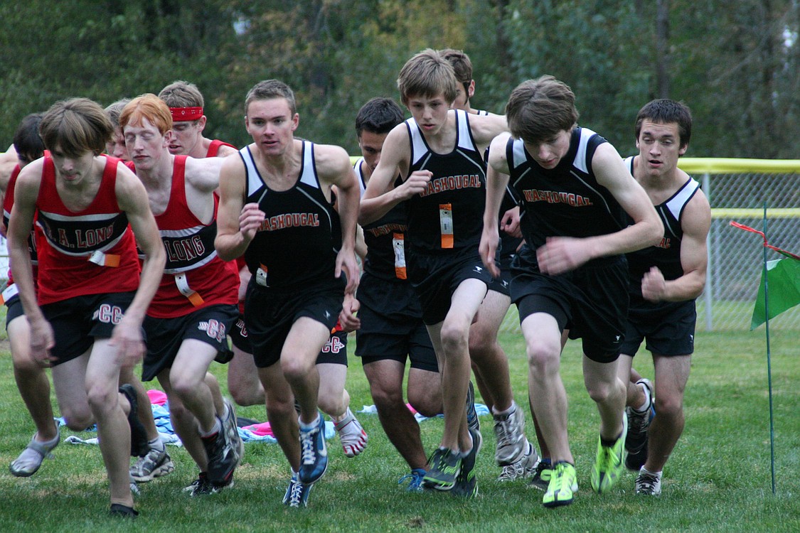 The Washougal High School boys cross country runners leave the starting line of the league championship race Oct. 21, at Hockinson Meadows.