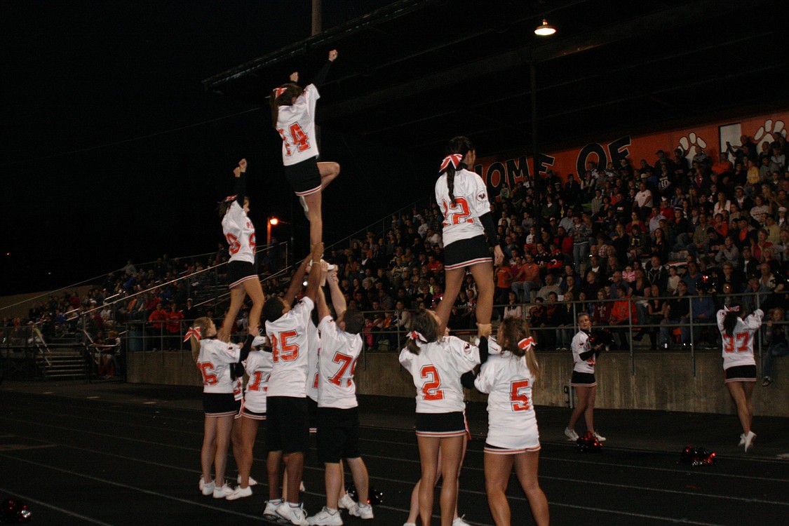 The Washougal High School cheerleaders dazzle a full house at Fishback Stadium.
