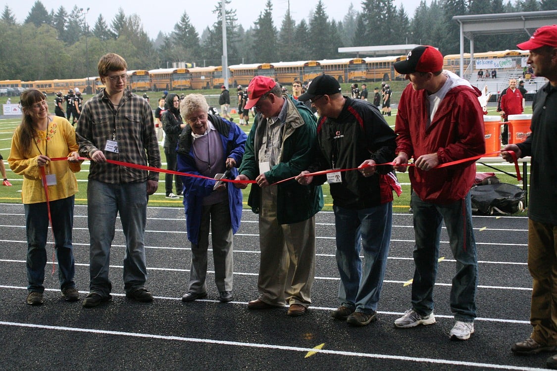 Family members of Doc Harris cut the ribbon on opening night.