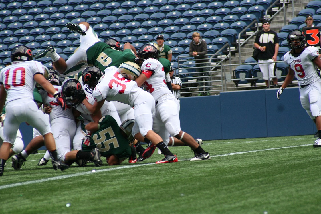 The Papermaker defensive machine prevent's Timberline's Quinton Sison from leaping into the end zone.