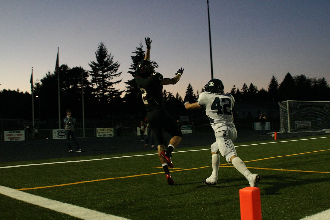 Brent Hill looks to catch a falling star for the Camas High School football team Sept. 24, at Doc Harris Stadium.