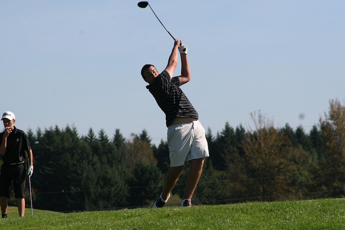 Ben Gibson tees off for the Camas High School golf team Oct. 13, during the district tournament at the Tri-Mountain golf course in Ridgefield.