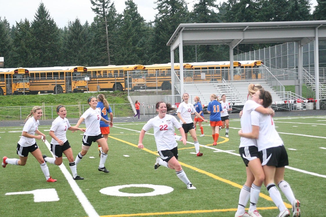 The Camas High School girls soccer players celebrate the goal that propelled them to the state tournament Nov. 5, at Doc Harris Stadium.