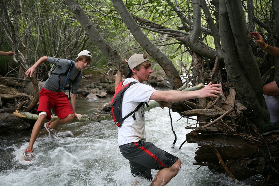 Sean Eustis and Isaac Stinchfield crossing the water.