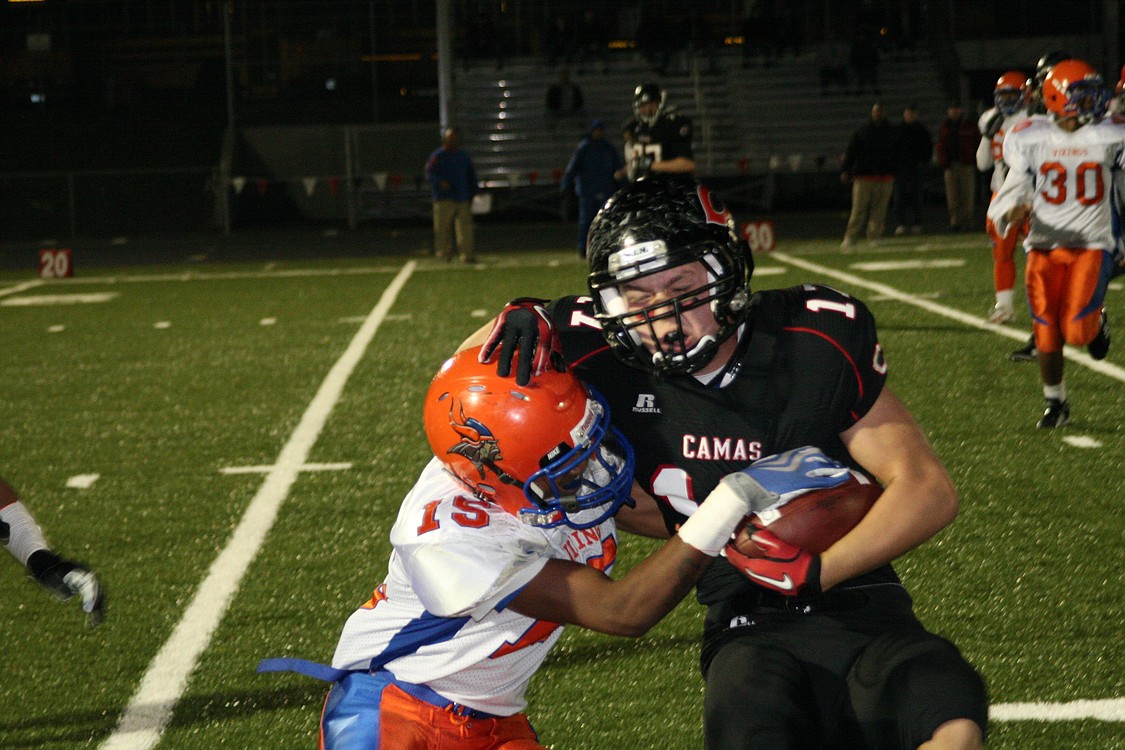 Kyle Ervin keeps the football close to his chest for Camas Nov. 5, at Doc Harris Stadium.