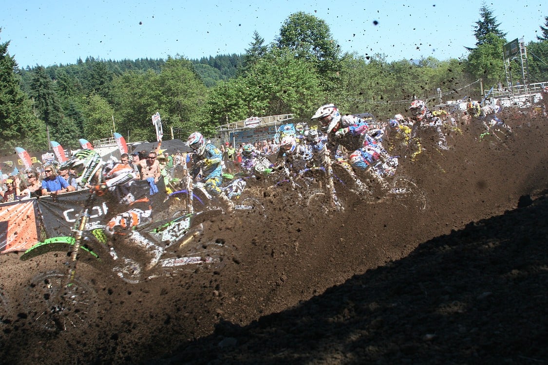 Dirt kicks up as the riders fly by.