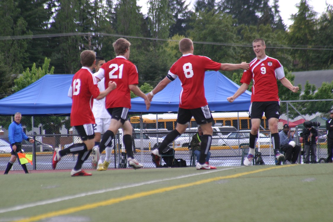 Parker Roland, Nathan Beasley, Drew White and Adam Allison (left to right) celebrate the first of seven goals scored by the Papermakers in the final four.