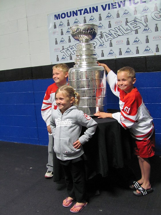 Kids posing by the Cup.