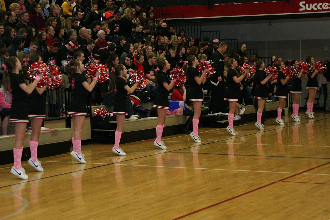 The Camas cheerleaders pump up a sold out crowd.