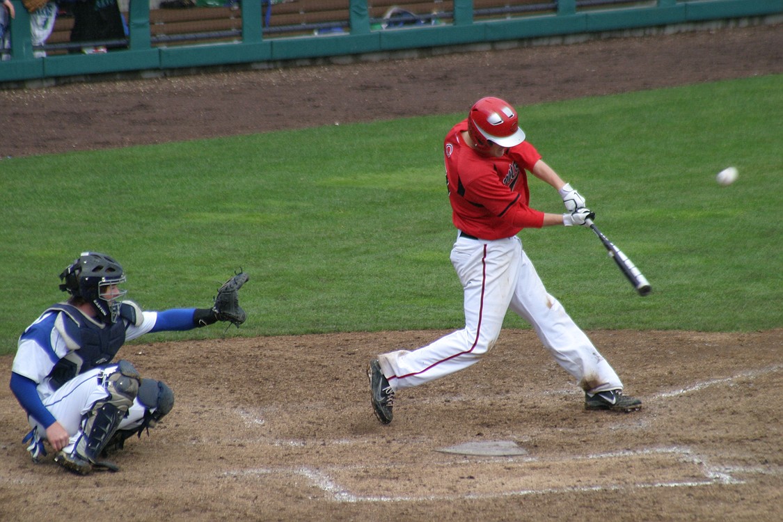 The baseball goes screaming off the bat of Logan Grindy.