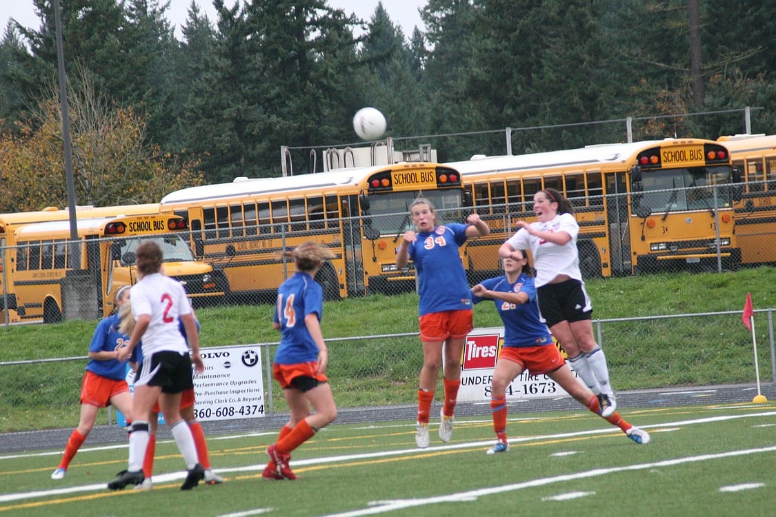 Janae Benson and a defender from Auburn Mountainview elevate for the soccer ball off a Camas corner kick Nov. 5, at Doc Harris Stadium.
