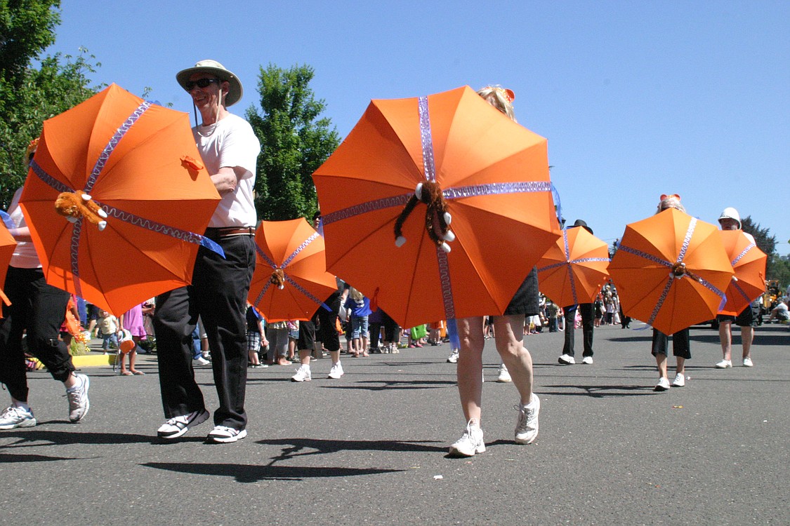 The Lacamas Shores Umbrella Drill Team has become a mainstay entry in the parade. This year to go with the "Jungle" them, their bright orange umbrellas were decked out with stuffed monkeys.