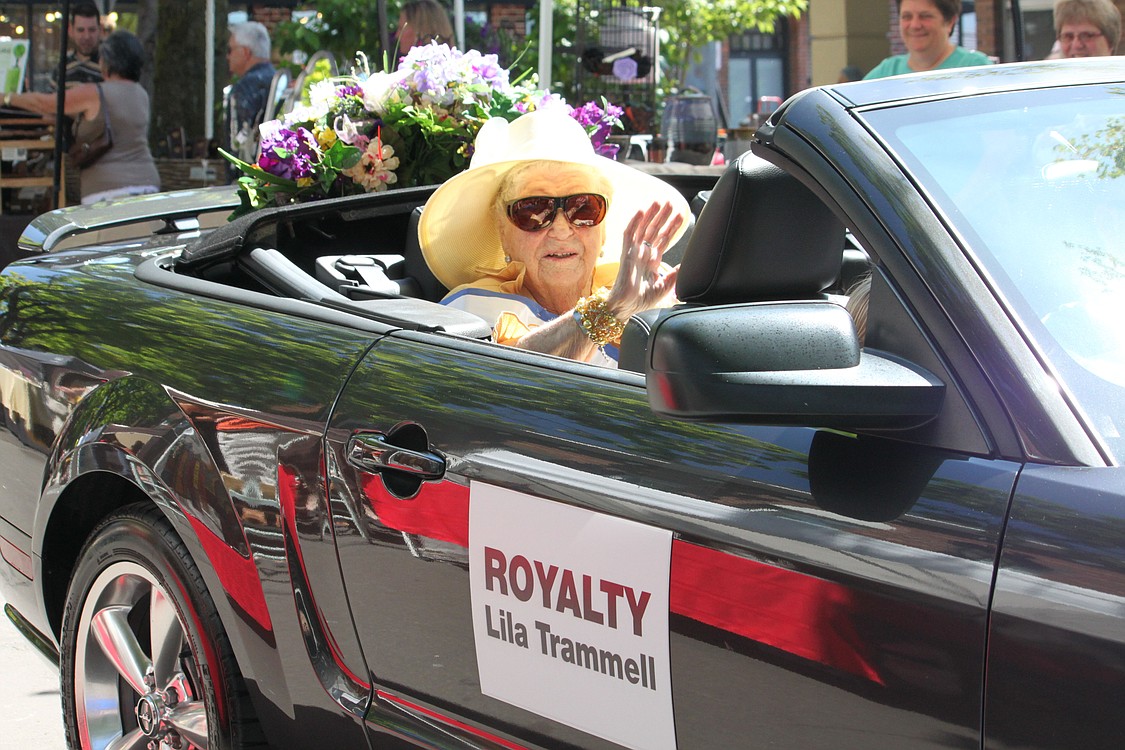 Camas Days Queen Lila Trammell waves to onlookers at the main parade Saturday.