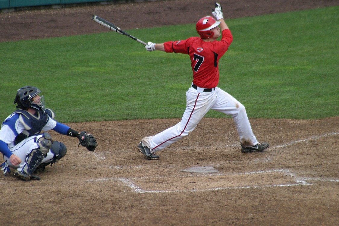 Logan Grindy watches the ball as it hits the right field foul pole for a home run.