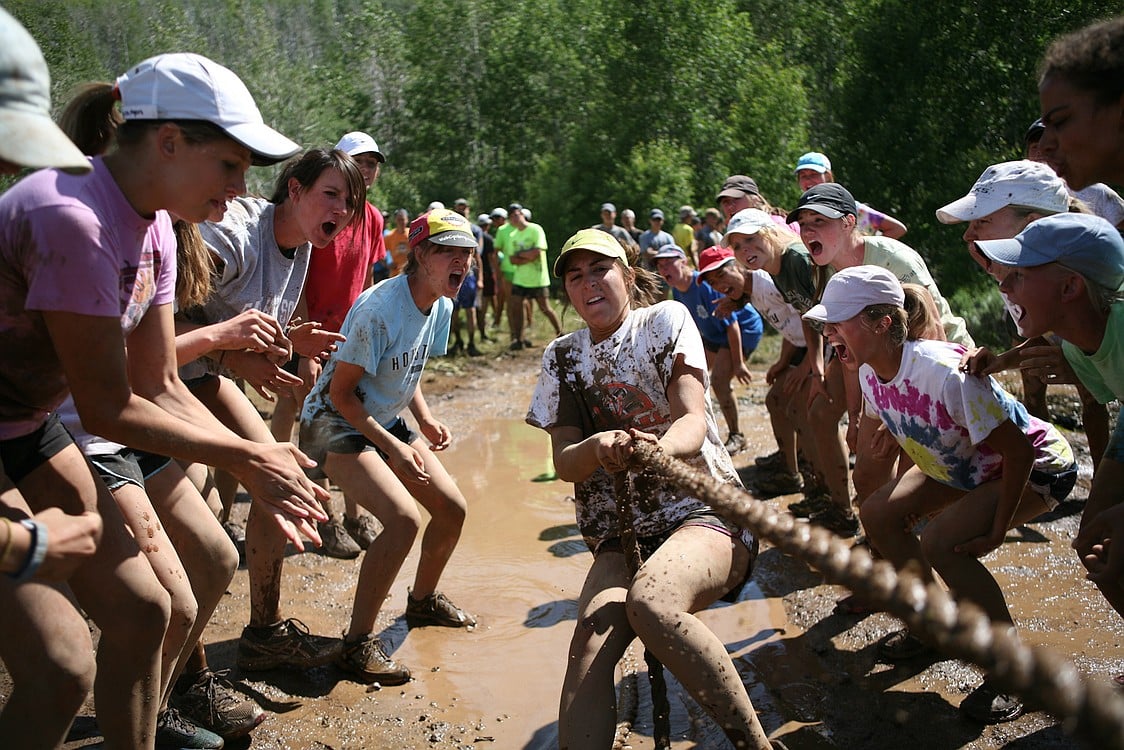 Kendall Utter gets knee-deep in the mud during the tug of war portion of the Steens Mountain Camp Olympic Games.